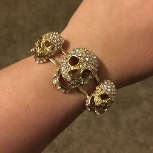 Five skull gold tone cuff bracelet